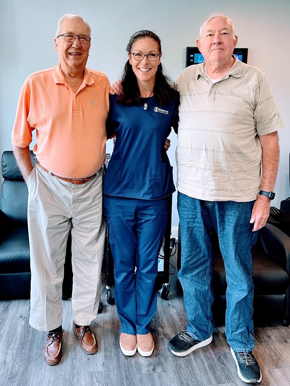 Group photo of three people standing together