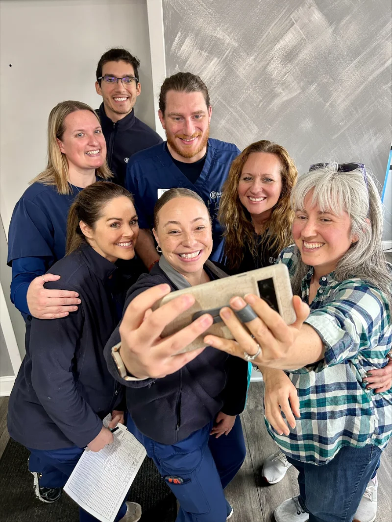 Group photo of Balance Wellspace team and patients smiling
